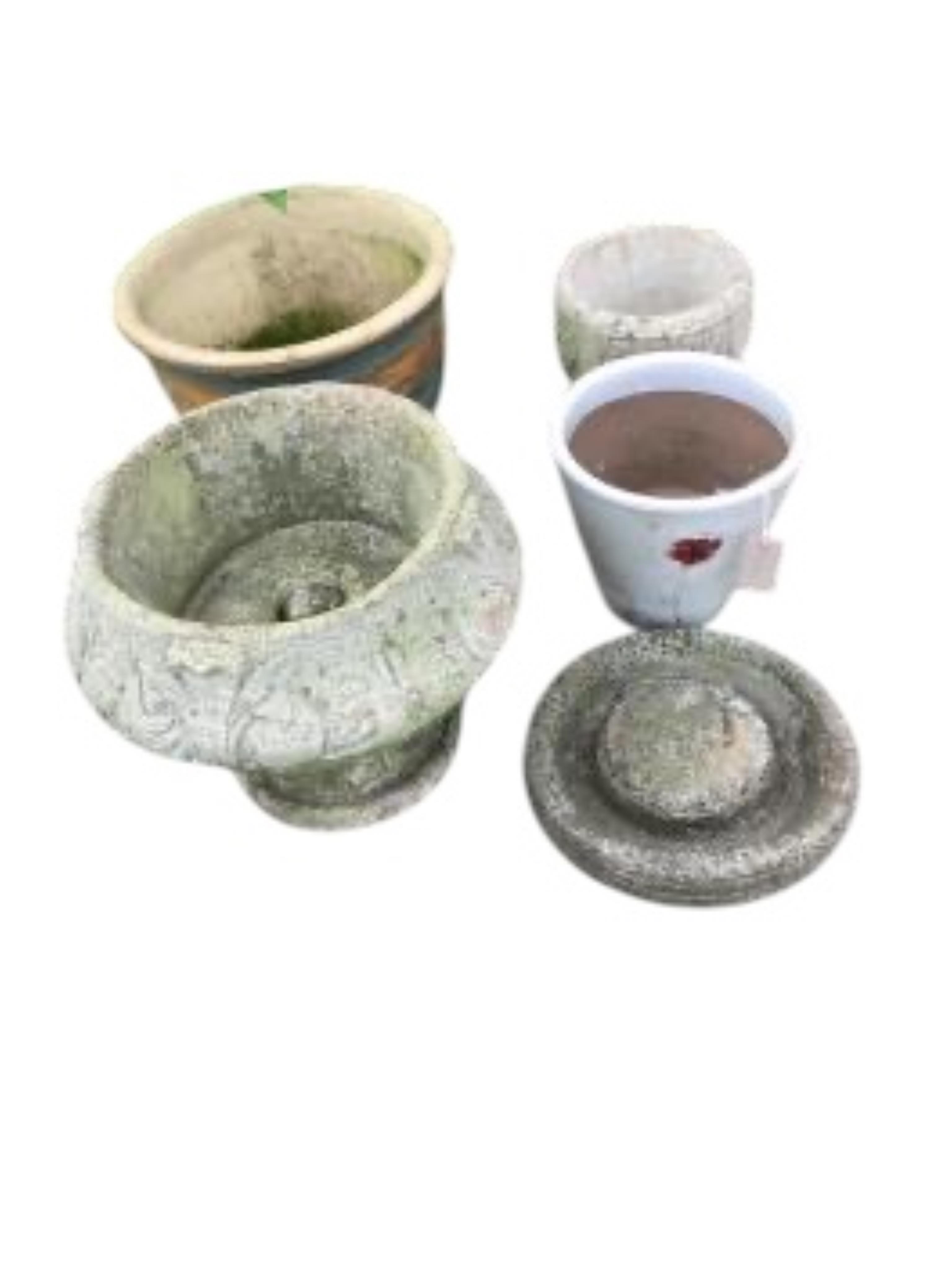 Six assorted stone and earthenware garden planters and a bird bath, largest diameter 38cm, height 32cm
